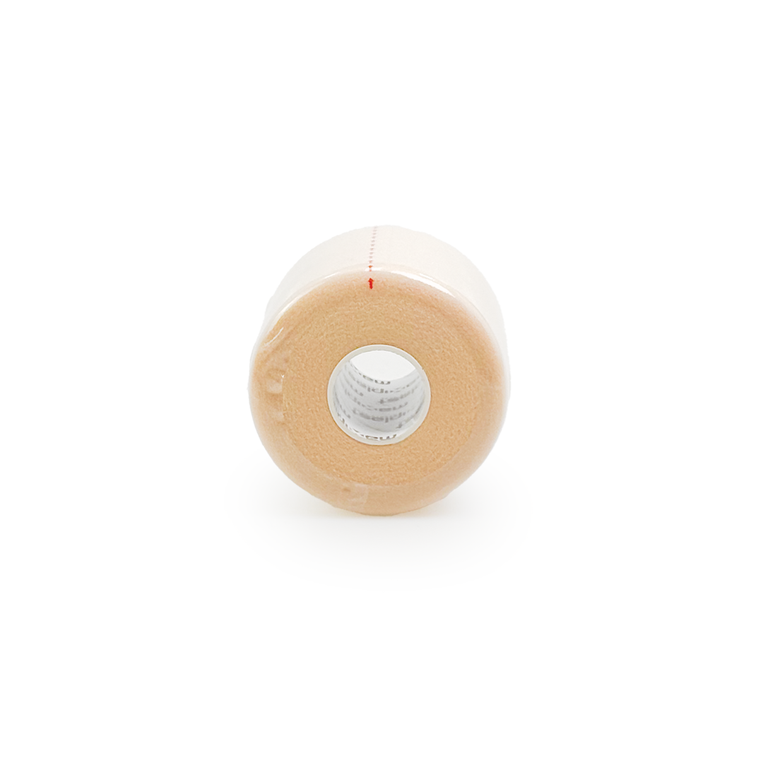 Roll of beige medical tape on a white background