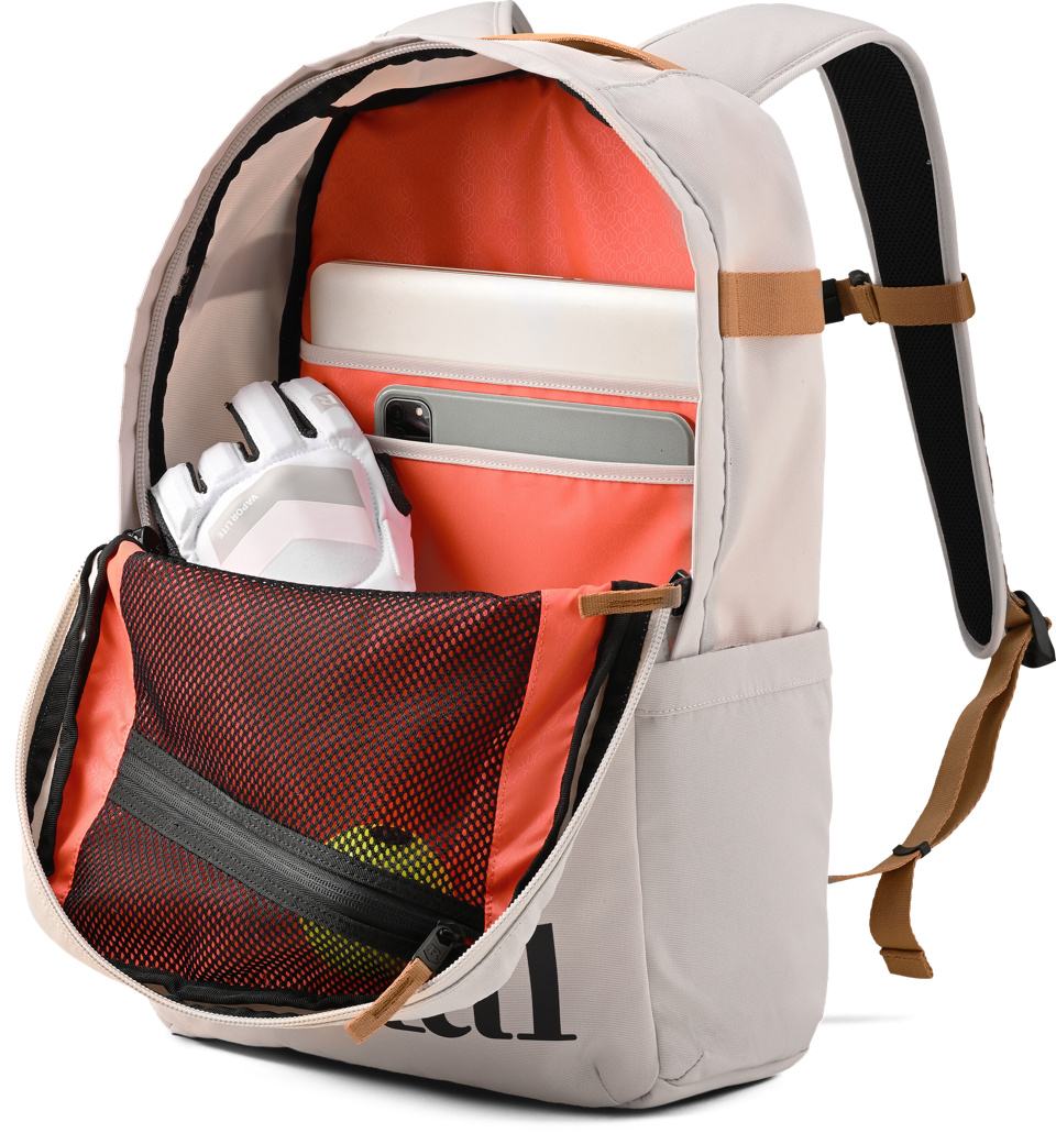 Ritual Covert hockey backpack white with orange interior and items, inside view