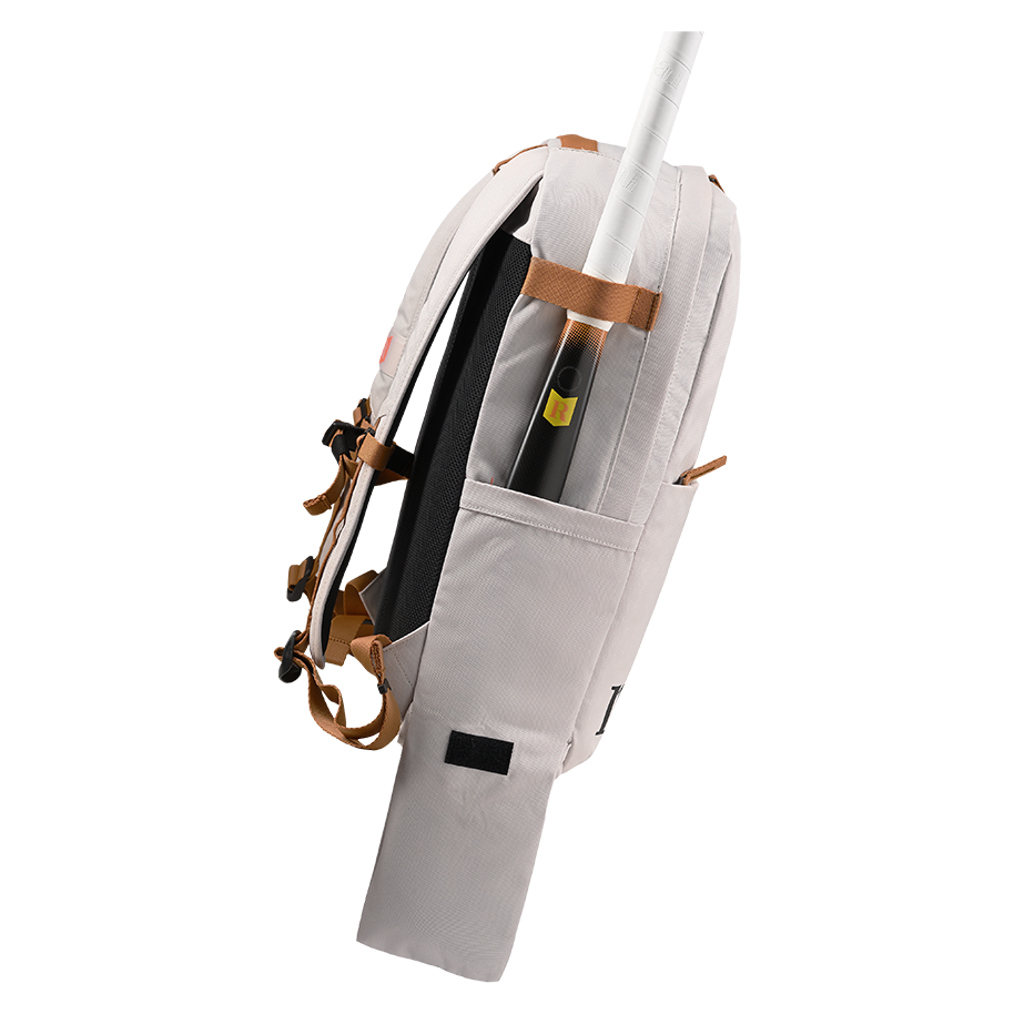 Ritual Covert hockey backpack white with brown leather straps and stick, left side view