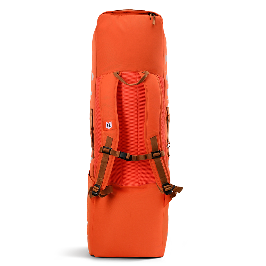 Ritual Hockey orange combo stick bag with brown straps on a white background