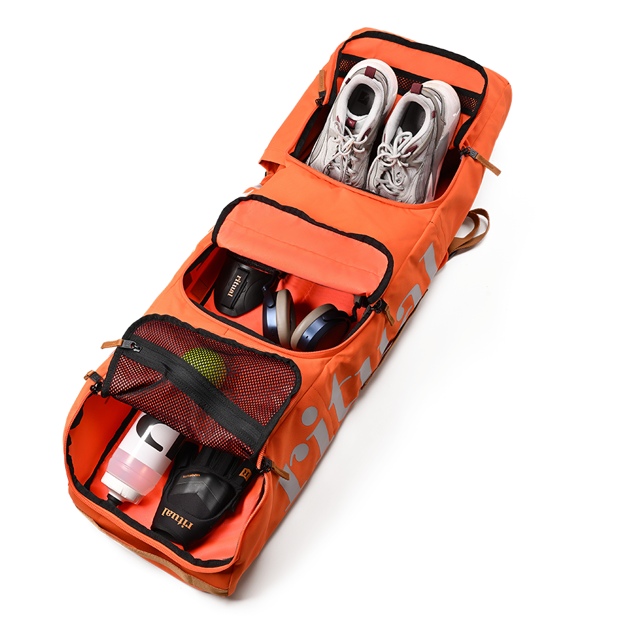 Ritual Hockey orange combo stick bag with shoes and other items, inside view