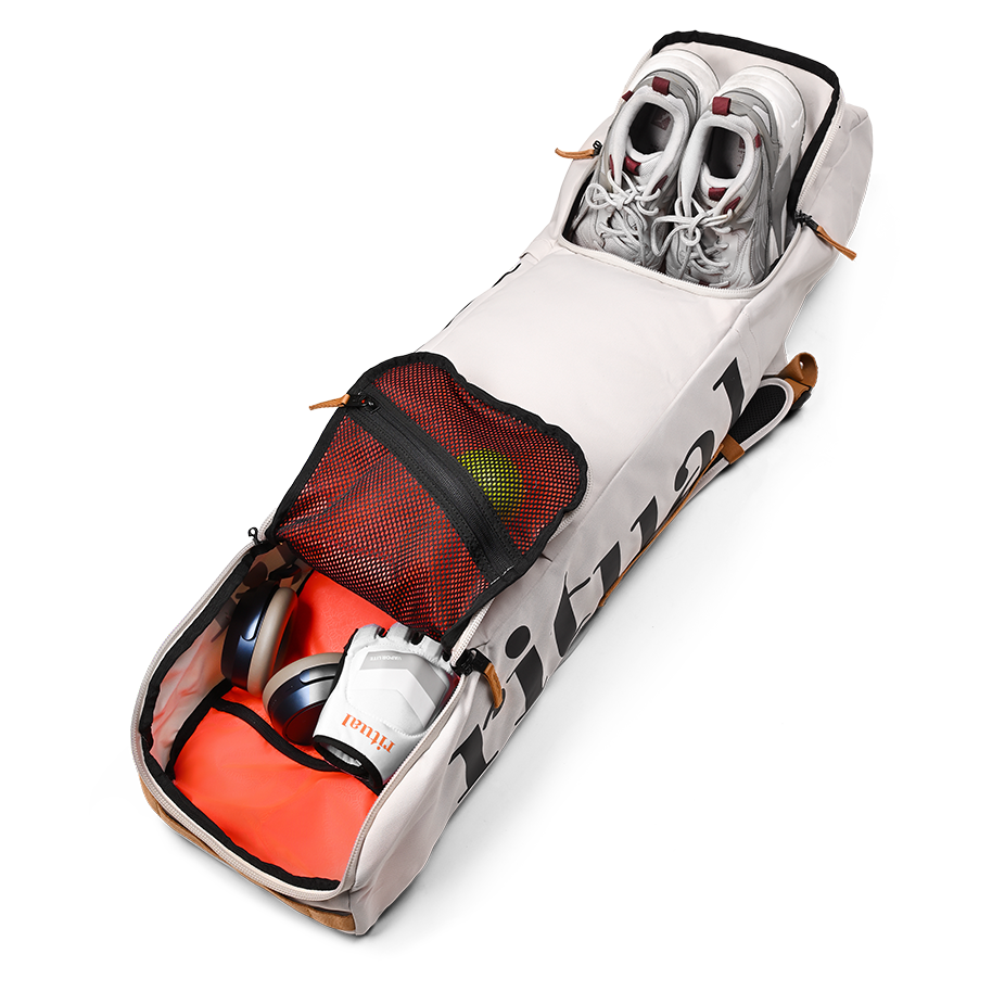 Ritual Tactic combo hockey bag white with red interior holding two pairs of shoes, inside view