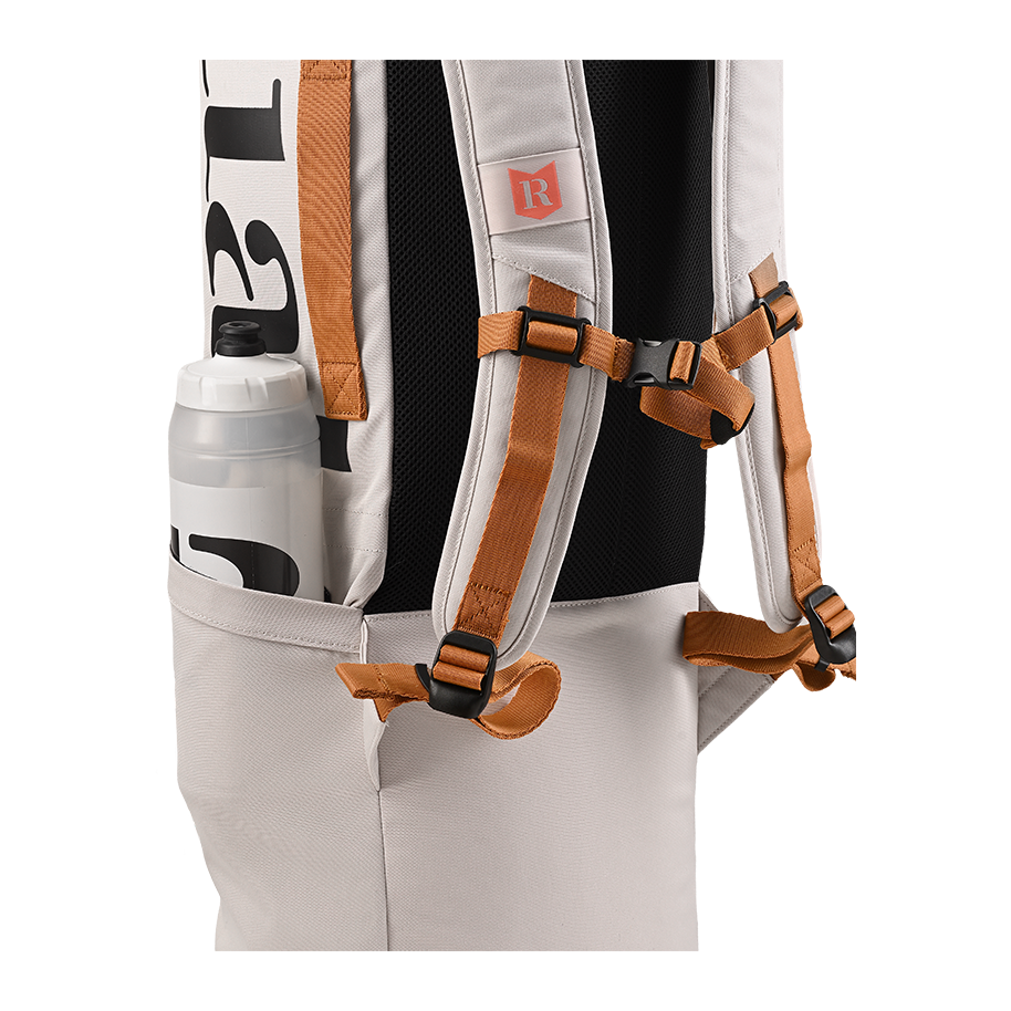 Ritual Tactic combo hockey bag white with brown straps and a water bottle pocket, closeup view